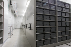 Black Boxes neatly stacked in rows on Spacesaver Mobile Shelving at Holocaust Memorial Museum