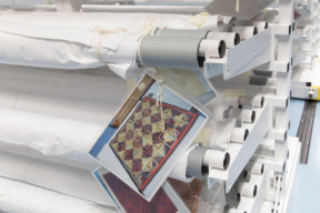 Textile Racks with image cards showing unrolled textile - Museum Storage